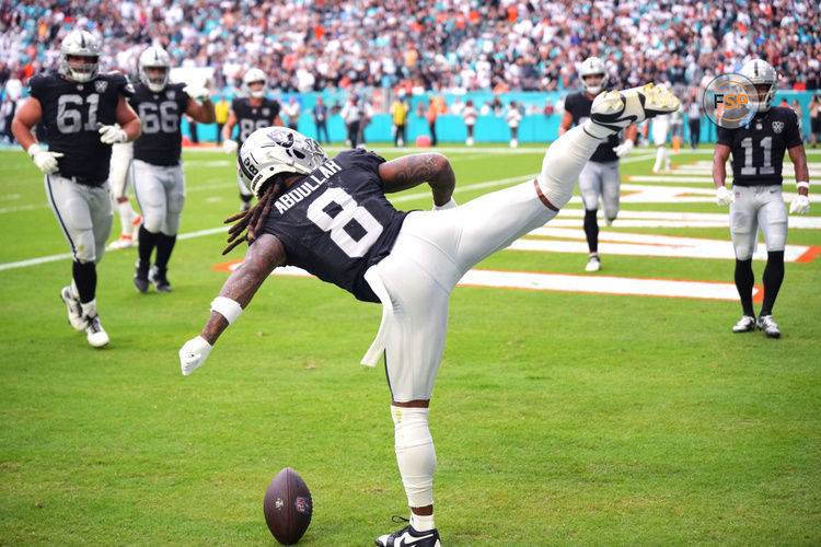 Nov 17, 2024; Miami Gardens, Florida, USA; Las Vegas Raiders running back Ameer Abdullah (8) celebrates a touchdown against the Miami Dolphins in the fourth quarter with a roundhouse kick at Hard Rock Stadium. Credit: Jim Rassol-Imagn Images