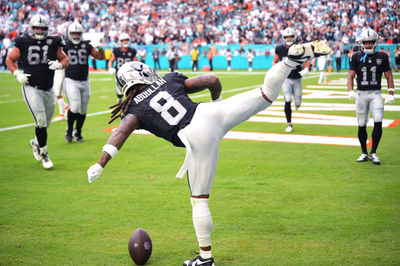 Nov 17, 2024; Miami Gardens, Florida, USA; Las Vegas Raiders running back Ameer Abdullah (8) celebrates a touchdown against the Miami Dolphins in the fourth quarter with a roundhouse kick at Hard Rock Stadium. Mandatory Credit: Jim Rassol-Imagn Images