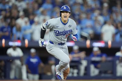Nov 1, 2025; Toronto, Ontario, CAN; Los Angeles Dodgers two-way player Shohei Ohtani (17) runs after hitting a single against the Toronto Blue Jays in the fifth inning during game seven of the 2025 MLB World Series at Rogers Centre. Mandatory Credit: John E. Sokolowski-Imagn Images