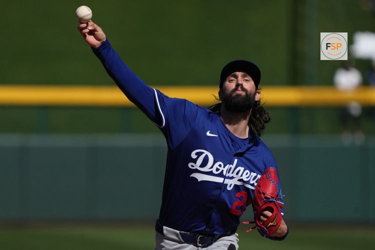 Feb 21, 2025; Mesa, Arizona, USA; Los Angeles Dodgers pitcher Tony Gonsolin (26) warms up during the first inning against the Chicago Cubs at Sloan Park. Credit: Rick Scuteri-Imagn Images