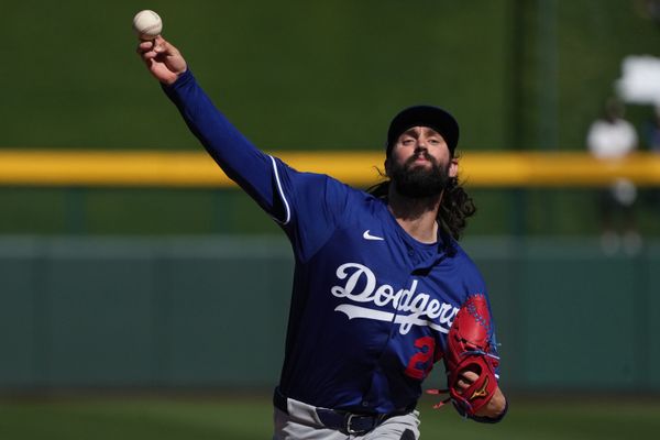 Feb 21, 2025; Mesa, Arizona, USA; Los Angeles Dodgers pitcher Tony Gonsolin (26) warms up during the first inning against the Chicago Cubs at Sloan Park. Mandatory Credit: Rick Scuteri-Imagn Images