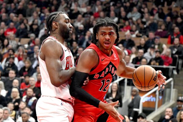 Feb 5, 2026; Toronto, Ontario, CAN; Toronto Raptors forward Collin Murray-Boyles (12) dribbles against Chicago Bulls forward Patrick Williams (44) in the first half at Scotiabank Arena. Mandatory Credit: Dan Hamilton-Imagn Images