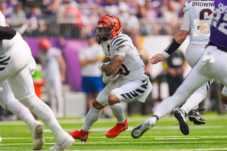Sep 21, 2025; Minneapolis, Minnesota, USA; Cincinnati Bengals running back Chase Brown (30) runs with the ball during the first half against the Minnesota Vikings at U.S. Bank Stadium. Credit: Brad Rempel-Imagn Images