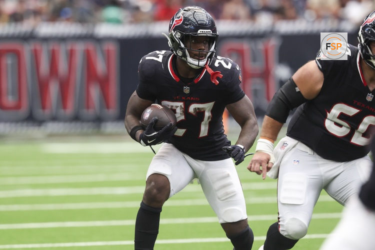 Sep 28, 2025; Houston, Texas, USA; Houston Texans running back Woody Marks (27) runs with the ball during the fourth quarter against the Tennessee Titans at NRG Stadium. Credit: Troy Taormina-Imagn Images