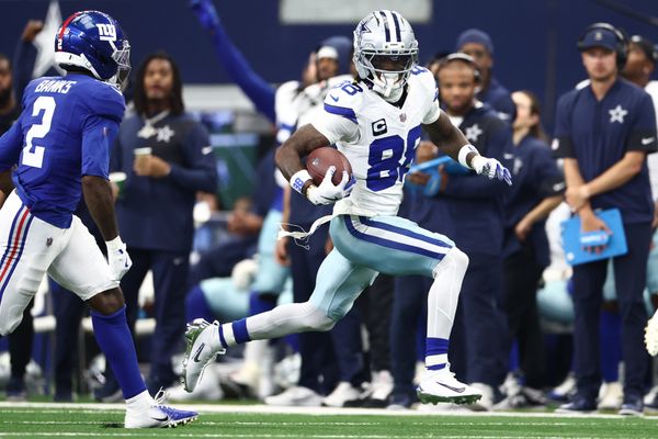 Sep 14, 2025; Arlington, Texas, USA; Dallas Cowboys wide receiver CeeDee Lamb (88) runs with the ball against the New York Giants during the second quarter at AT&T Stadium. Mandatory Credit: Kevin Jairaj-Imagn Images