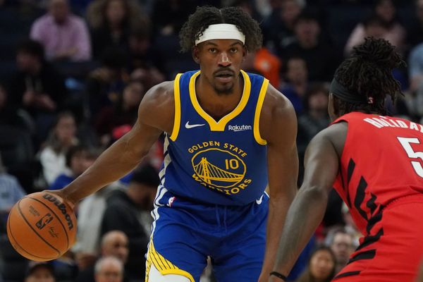 Jan 13, 2026; San Francisco, California, USA;  Golden State Warriors forward Jimmy Butler III (10) dribbles against Portland Trail Blazers guard Jrue Holiday (5) in the third quarter at Chase Center. Mandatory Credit: David Gonzales-Imagn Images