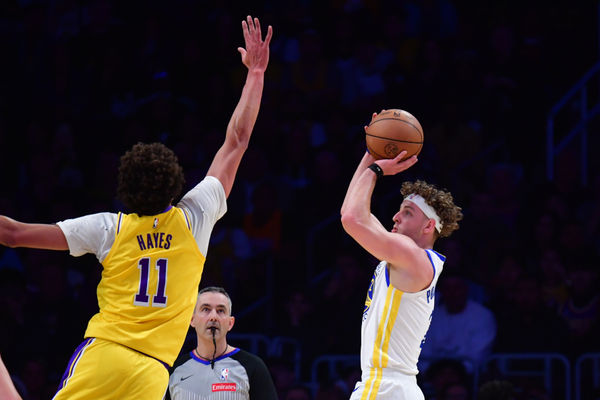 Apr 3, 2025; Los Angeles, California, USA;  Golden State Warriors guard Brandin Podziemski (2) shoots against Los Angeles Lakers center Jaxson Hayes (11) during the first half at Crypto.com Arena. Mandatory Credit: Gary A. Vasquez-Imagn Images