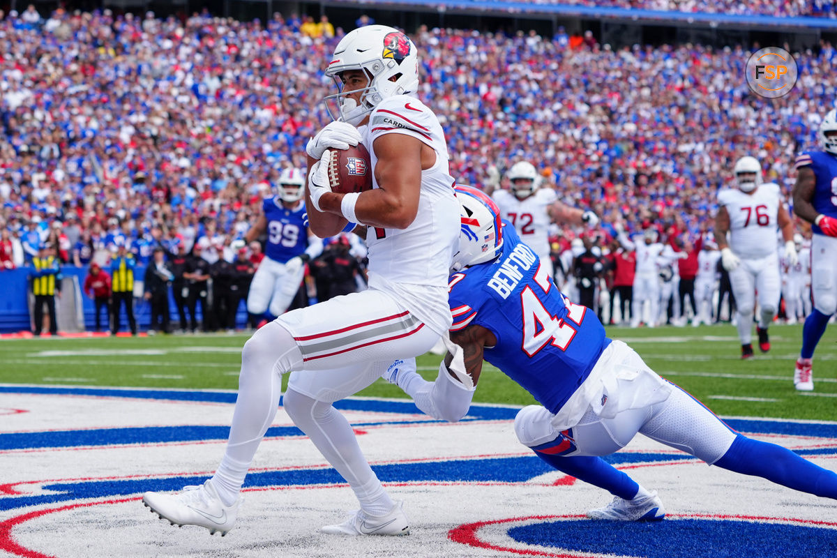 Sep 8, 2024; Orchard Park, New York, USA; Arizona Cardinals wide receiver Michael Wilson (14) makes a catch for a touchdown against Buffalo Bills cornerback Christian Benford (47) during the first half at Highmark Stadium. Credit: Gregory Fisher-Imagn Images