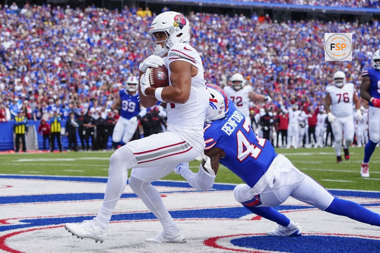 Sep 8, 2024; Orchard Park, New York, USA; Arizona Cardinals wide receiver Michael Wilson (14) makes a catch for a touchdown against Buffalo Bills cornerback Christian Benford (47) during the first half at Highmark Stadium. Credit: Gregory Fisher-Imagn Images