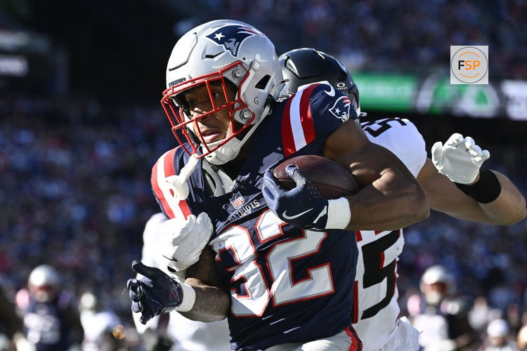 Nov 2, 2025; Foxborough, Massachusetts, USA; New England Patriots running back TreVeyon Henderson (32) runs the ball against the Atlanta Falcons during the first quarter at Gillette Stadium. Credit: Eric Canha-Imagn Images