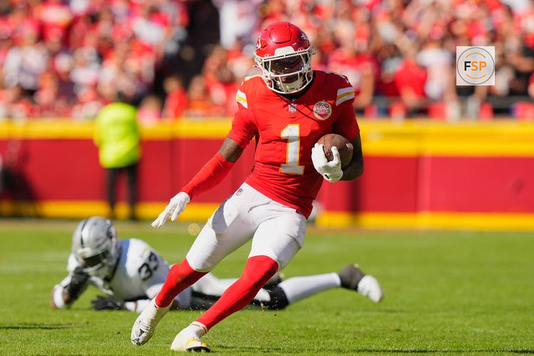 Oct 19, 2025; Kansas City, Missouri, USA; Kansas City Chiefs wide receiver Xavier Worthy (1) avoids a tackle by Las Vegas Raiders linebacker Jamal Adams (33) during the third quarter of the game at GEHA Field at Arrowhead Stadium. Credit: Jay Biggerstaff-Imagn Images