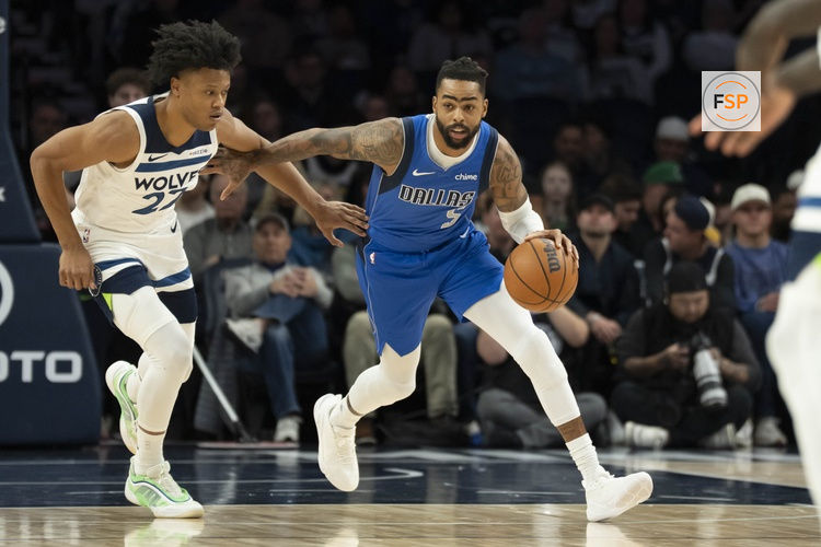 Nov 17, 2025; Minneapolis, Minnesota, USA; Dallas Mavericks guard D'Angelo Russell (5) dribbles the ball past Minnesota Timberwolves guard Jaylen Clark (22) in the first half at Target Center. Credit: Jesse Johnson-Imagn Images