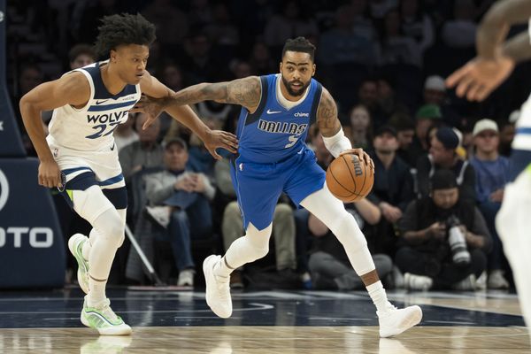 Nov 17, 2025; Minneapolis, Minnesota, USA; Dallas Mavericks guard D'Angelo Russell (5) dribbles the ball past Minnesota Timberwolves guard Jaylen Clark (22) in the first half at Target Center. Mandatory Credit: Jesse Johnson-Imagn Images