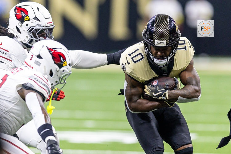 Sep 7, 2025; New Orleans, Louisiana, USA; New Orleans Saints wide receiver Brandin Cooks (10) is tackled by the Arizona Cardinals during the second half at Caesars Superdome. Credit: Stephen Lew-Imagn Images