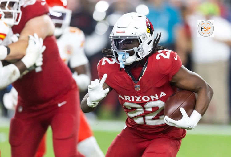 Aug 9, 2025; Glendale, Arizona, USA; Arizona Cardinals running back Michael Carter (22) against the Kansas City Chiefs during a preseason NFL game at State Farm Stadium. Credit: Mark J. Rebilas-Imagn Images