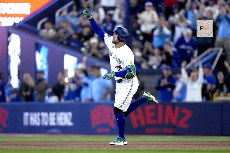 Mar 29, 2026; Toronto, Ontario, CAN; Toronto Blue Jays designated hitter George Springer (4) celebrates his solo home run off of the first pitch form Athletics starting pitcher Luis Morales during the first inning at Rogers Centre. Credit: John E. Sokolowski-Imagn Images