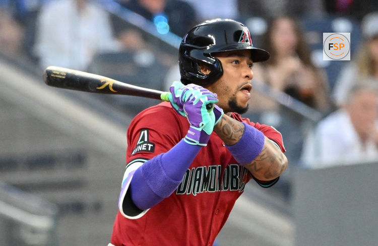 Jun 17, 2025; Toronto, Ontario, CAN;  Arizona Diamondbacks second baseman Ketel Marte (4) hits an RBI single against the Toronto Blue Jays in the fifth inning at Rogers Centre. Credit: Dan Hamilton-Imagn Images