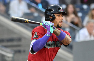 Jun 17, 2025; Toronto, Ontario, CAN;  Arizona Diamondbacks second baseman Ketel Marte (4) hits an RBI single against the Toronto Blue Jays in the fifth inning at Rogers Centre. Mandatory Credit: Dan Hamilton-Imagn Images
