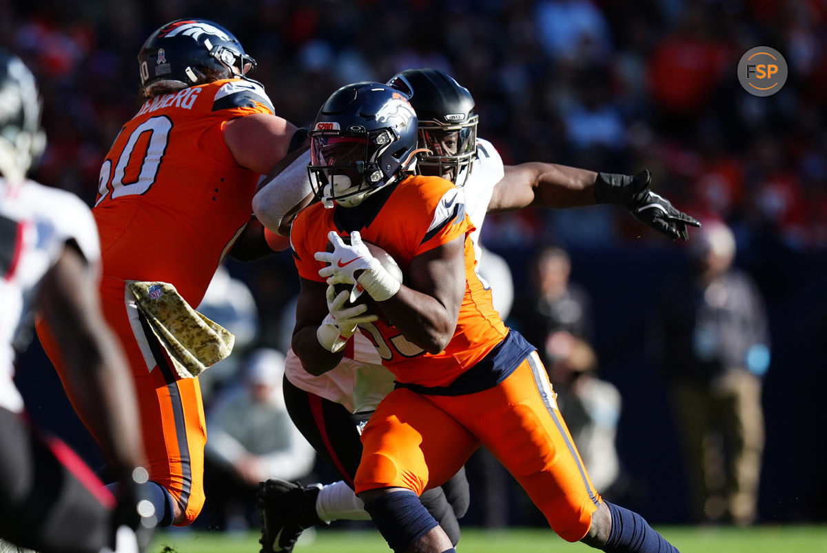 November 17, 2024; Denver, Colorado, USA; Denver Broncos running back Javonte Williams (33) carries the ball in the first quarter against the Atlanta Falcons at Empower Field at Mile High. Photo credit: Ron Chenoy-Imagn Images