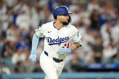 Jun 18, 2025; Los Angeles, California, USA; Los Angeles Dodgers left fielder Andy Pages (44) hits a RBI sacrifice fly in the fifth inning against the San Diego Padres at Dodger Stadium. Mandatory Credit: Kirby Lee-Imagn Images