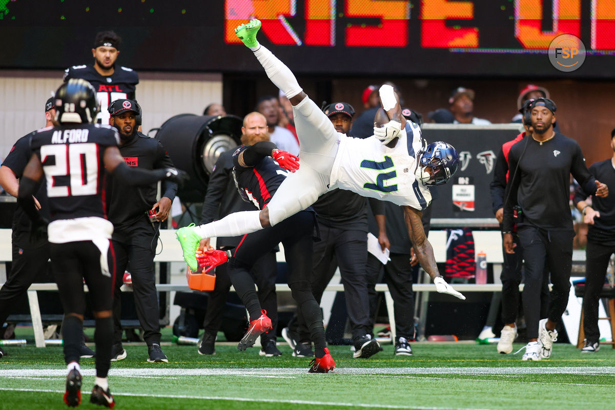 Oct 20, 2024; Atlanta, Georgia, USA; Atlanta Falcons safety Justin Simmons (31) breaks up a pass intended for Seattle Seahawks wide receiver DK Metcalf (14) in the third quarter at Mercedes-Benz Stadium. Credit: Brett Davis-Imagn Images
