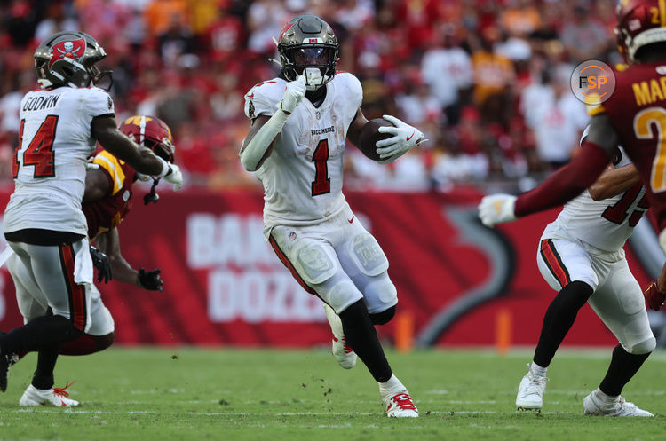 Sep 8, 2024; Tampa, Florida, USA;  Tampa Bay Buccaneers running back Rachaad White (1) runs with the ball against the Washington Commanders during the second half at Raymond James Stadium. Credit: Kim Klement Neitzel-Imagn Images