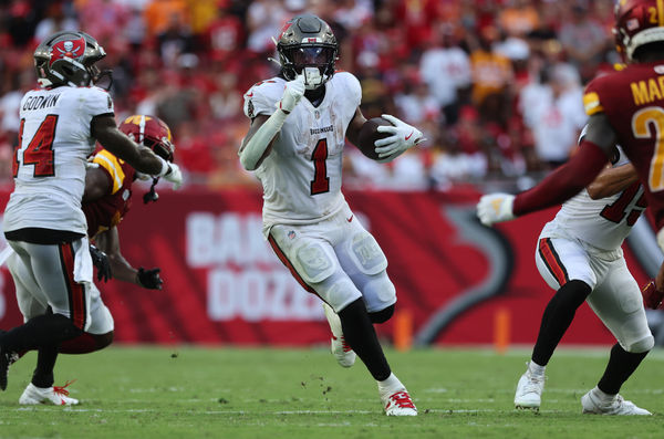 Sep 8, 2024; Tampa, Florida, USA;  Tampa Bay Buccaneers running back Rachaad White (1) runs with the ball against the Washington Commanders during the second half at Raymond James Stadium. Mandatory Credit: Kim Klement Neitzel-Imagn Images