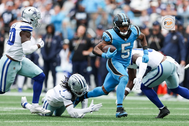 Oct 12, 2025; Charlotte, North Carolina, USA; Carolina Panthers running back Rico Dowdle (5) runs with the ball during the second half against the Dallas Cowboys at Bank of America Stadium. Credit: Cory Knowlton-Imagn Images