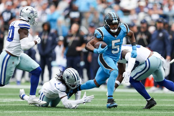 Oct 12, 2025; Charlotte, North Carolina, USA; Carolina Panthers running back Rico Dowdle (5) runs with the ball during the second half against the Dallas Cowboys at Bank of America Stadium. Mandatory Credit: Cory Knowlton-Imagn Images