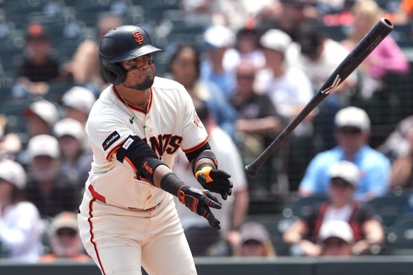 Jul 12, 2026; San Francisco, California, USA; San Francisco Giants second baseman Luis Arraez (1) tosses his bat after drawing a walk against the Colorado Rockies during the third inning at Oracle Park. Mandatory Credit: Darren Yamashita-Imagn Images