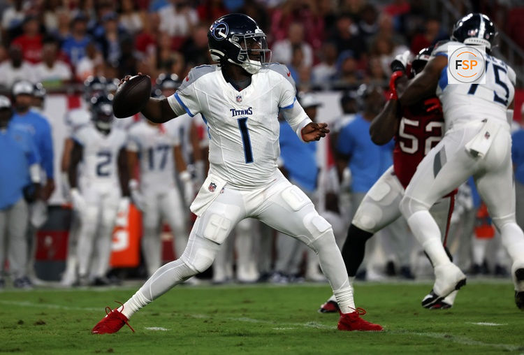 Aug 9, 2025; Tampa, Florida, USA; Tennessee Titans quarterback Cameron Ward (1) throws the ball against the Tampa Bay Buccaneers during the first half at Raymond James Stadium. Credit: Kim Klement Neitzel-Imagn Images