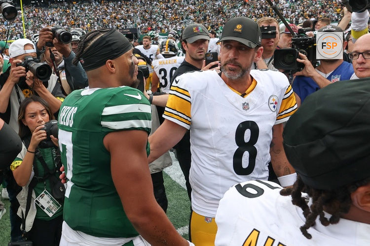 Sep 7, 2025; East Rutherford, New Jersey, USA; New York Jets quarterback Justin Fields (7) greets Pittsburgh Steelers quarterback Aaron Rodgers (8) after the game at MetLife Stadium. Credit: Wendell Cruz-Imagn Images