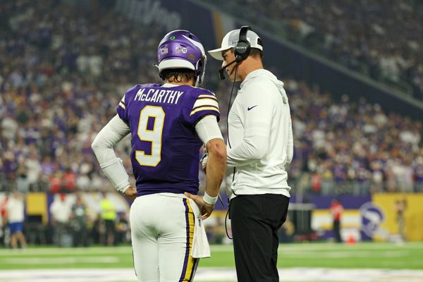 Sep 14, 2025; Minneapolis, Minnesota, USA; Minnesota Vikings quarterback J.J. McCarthy (9) speaks with Minnesota Vikings head coach Kevin O'Connell during the first half against the Atlanta Falcons at U.S. Bank Stadium. Mandatory Credit: Matt Krohn-Imagn Images