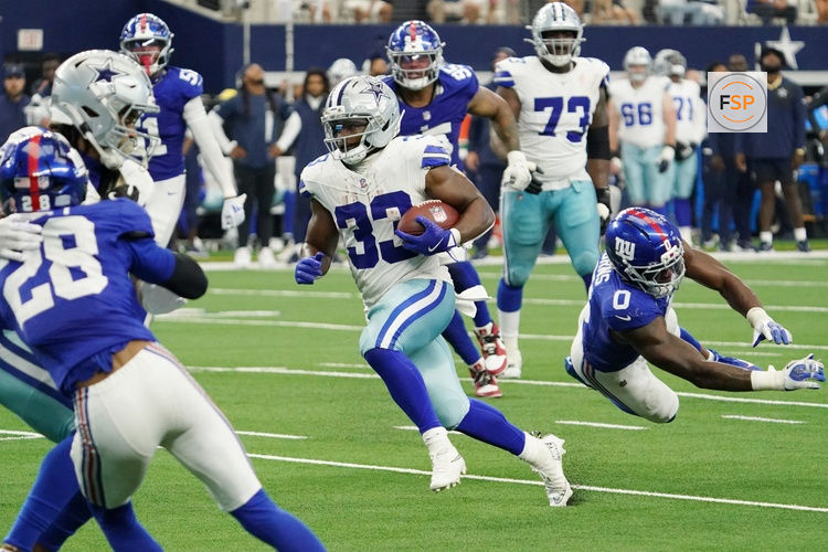 Sep 14, 2025; Arlington, Texas, USA; Dallas Cowboys running back Javonte Williams (33) runs with the ball against the New York Giants during the fourth quarter at AT&T Stadium. Credit: Raymond Carlin III-Imagn Images