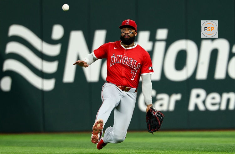 Aug 27, 2025; Arlington, Texas, USA;  Los Angeles Angels right fielder Jo Adell (7) dives for but cannot make a catch during the fourth inning against the Texas Rangers at Globe Life Field. Credit: Kevin Jairaj-Imagn Images