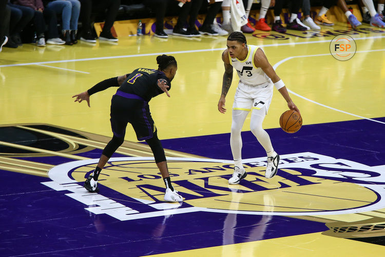 LOS ANGELES, CA - NOVEMBER 21: Utah Jazz guard Keyonte George (3) guarded by Los Angeles Lakers guard D'Angelo Russell (1) at center court during the Utah Jazz vs Los Angeles Lakers game on November 21, 2023, at Crypto.com Arena in Los Angeles, CA. (Photo by Jevone Moore/Icon Sportswire)