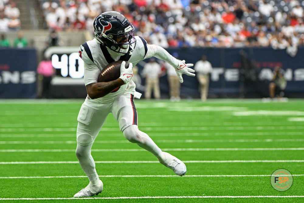 HOUSTON, TX - SEPTEMBER 17: Houston Texans wide receiver Tank Dell (3) looks for running room in the flat after a short reception during the football game between the Indianapolis Colts and Houston Texans at NRG Stadium on September 17, 2023, in Houston, Texas. (Photo by Ken Murray/Icon Sportswire)