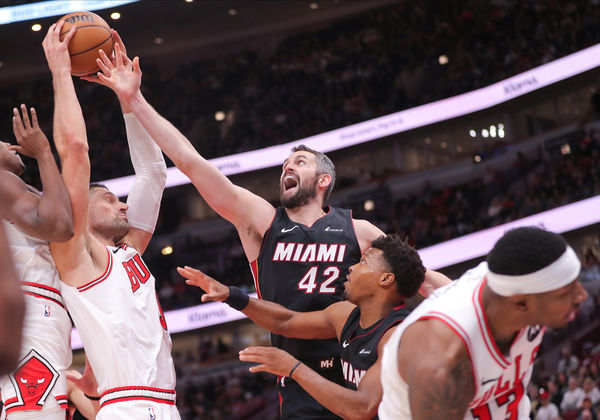 CHICAGO, IL - NOVEMBER 20: Nikola Vucevic #9 of the Chicago Bulls and Kevin Love #42 of the Miami Heat battle for a rebound during the second half at the United Center on November 20, 2023 in Chicago, Illinois. (Photo by Melissa Tamez/Icon Sportswire)