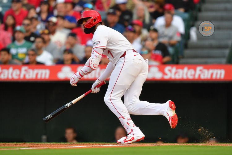Jun 23, 2025; Anaheim, California, USA; Los Angeles Angels center fielder Jo Adell (7) hits an RBI single against the Boston Red Sox during the first inning at Angel Stadium. Credit: Gary A. Vasquez-Imagn Images