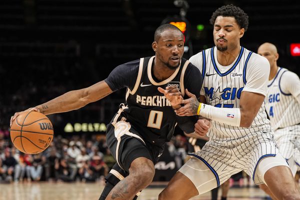 Mar 16, 2026; Atlanta, Georgia, USA; Atlanta Hawks forward Jonathan Kuminga (0) dribbles against Orlando Magic guard Jett Howard (13) during the second half at State Farm Arena. Mandatory Credit: Dale Zanine-Imagn Images