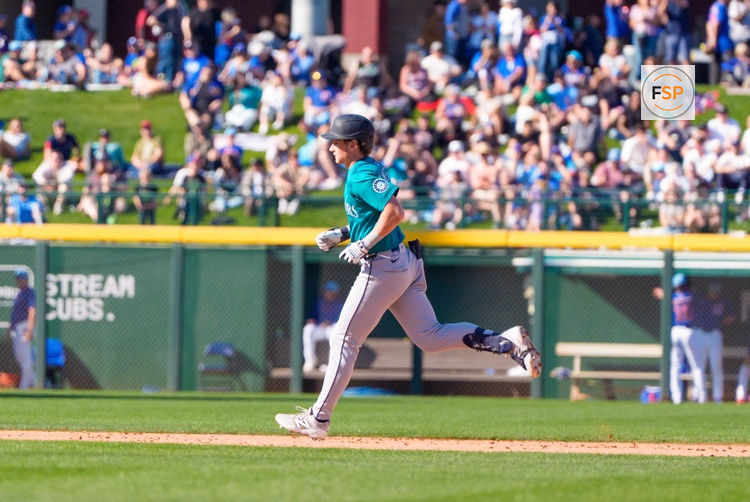 Mar 8, 2025; Mesa, Arizona, USA; Seattle Mariners infielder Colt Emerson (85) hits a home run in the top of the ninth during a spring training game against the Chicago Cubs at Sloan Park. Credit: Allan Henry-Imagn Images