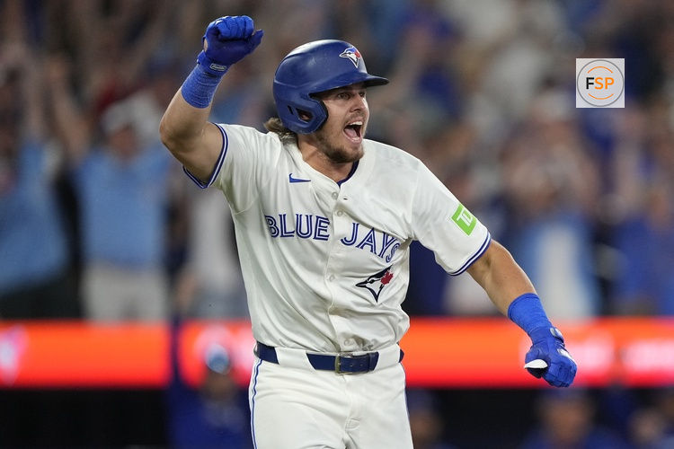Jul 5, 2025; Toronto, Ontario, CAN; Toronto Blue Jays right fielder Addison Barger (47) reacts after hitting a walk off single against the Los Angeles Angels during the 11th inning at Rogers Centre. Credit: John E. Sokolowski-Imagn Images