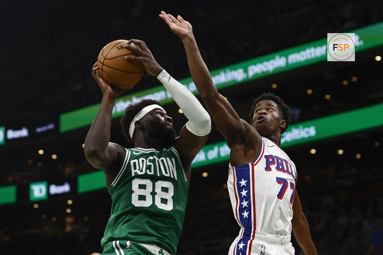 Oct 22, 2025; Boston, Massachusetts, USA; Boston Celtics center Neemias Queta (88) grabs a rebound next to Philadelphia 76ers guard VJ Edgecombe (77) during the first quarter at TD Garden. Credit: Winslow Townson-Imagn Images