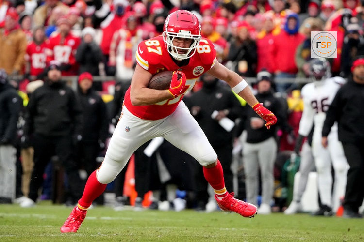 Jan 18, 2025; Kansas City, Missouri, USA; Kansas City Chiefs tight end Travis Kelce (87) runs the ball after a pass reception against the Houston Texans during the second quarter of a 2025 AFC divisional round game at GEHA Field at Arrowhead Stadium. Credit: Denny Medley-Imagn Images