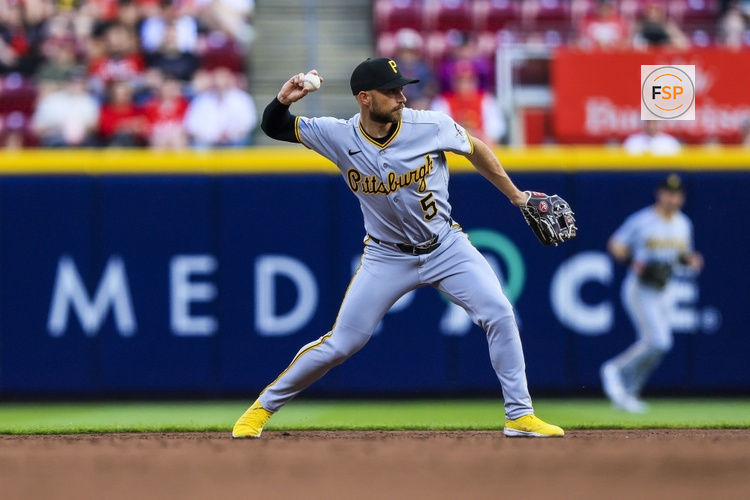 Mar 30, 2026; Cincinnati, Ohio, USA; Pittsburgh Pirates second baseman Brandon Lowe (5) throws to first to get Cincinnati Reds outfielder Spencer Steer (not pictured) out in the second inning at Great American Ball Park. Credit: Katie Stratman-Imagn Images
