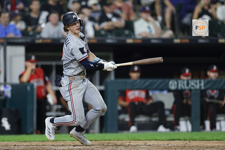 Aug 22, 2025; Chicago, Illinois, USA; Minnesota Twins second baseman Luke Keaschall (15) hits an RBI-single against the Chicago White Sox during the sixth inning at Rate Field. Credit: Kamil Krzaczynski-Imagn Images