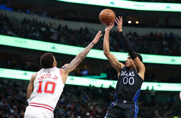 Jan 3, 2026; Dallas, Texas, USA; Dallas Mavericks guard Max Christie (00) shoots over Houston Rockets forward Jabari Smith Jr. (10) during the second half at American Airlines Center. Mandatory Credit: Kevin Jairaj-Imagn Images