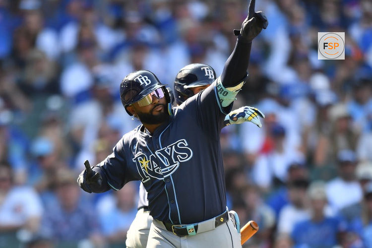 Sep 13, 2025; Chicago, Illinois, USA; Tampa Bay Rays third baseman Junior Caminero (13) celebrates with right fielder Josh Lowe (15) after hitting a solo home run against the Chicago Cubs during the eighth inning at Wrigley Field. Credit: Patrick Gorski-Imagn Images