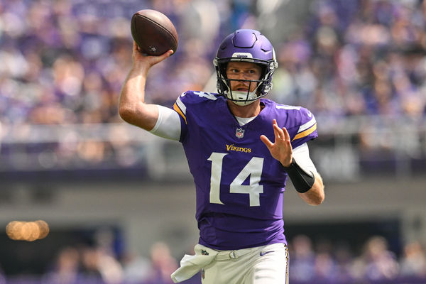 Aug 10, 2024; Minneapolis, Minnesota, USA; Minnesota Vikings quarterback Sam Darnold (14) throws a pass against the Las Vegas Raiders during the first quarter at U.S. Bank Stadium. Mandatory Credit: Jeffrey Becker-USA TODAY Sports