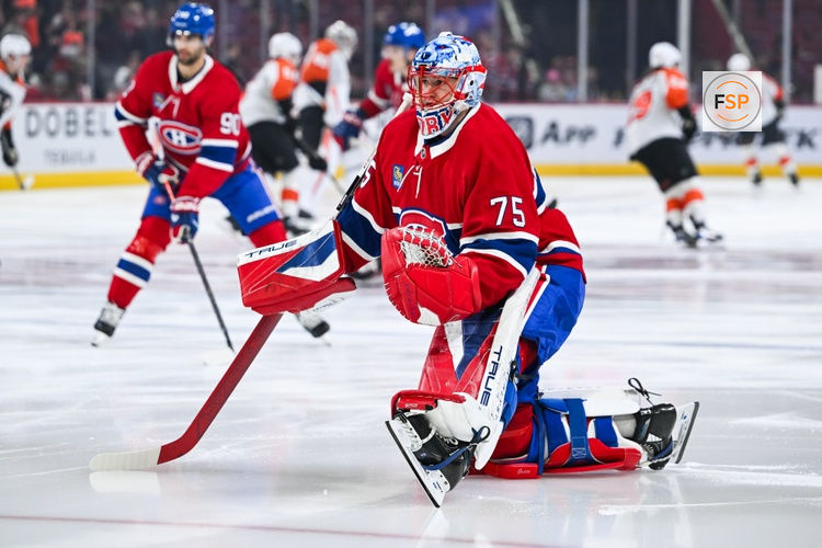 Nov 4, 2025; Montreal, Quebec, CAN; Montreal Canadiens goalie Jakub Dobes (75) stretches during warm-up before the game against the Philadelphia Flyers at Bell Centre. Credit: David Kirouac-Imagn Images